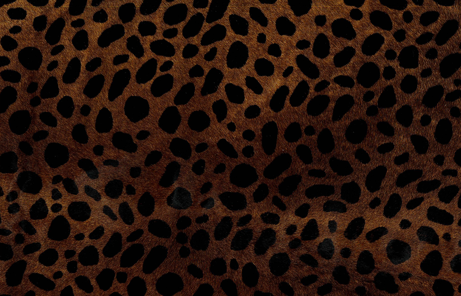 Hand dyed cheetah-print cowhide with natural patina, sourced in Los Angeles"