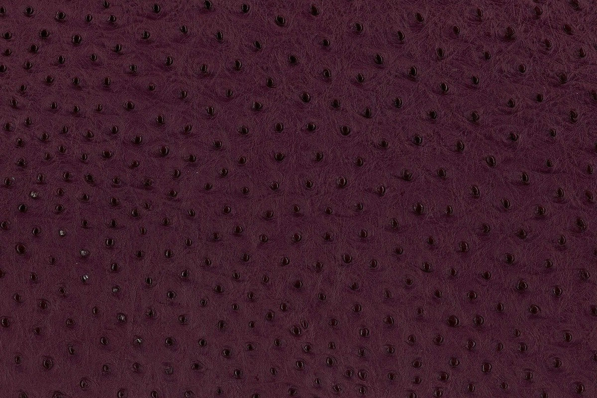Lambskin embossed with ostrich texture in deep plum, hand-stitched in Los Angeles