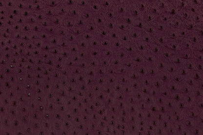 Lambskin embossed with ostrich texture in deep plum, hand-stitched in Los Angeles